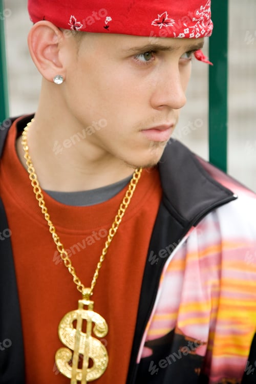 Preview: A Teenage Boy Wearing A Bandana And Money Chain