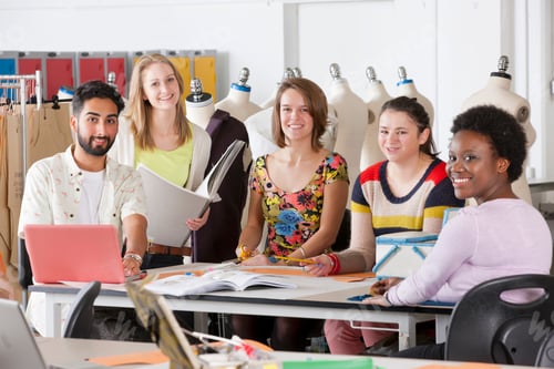 Preview: A Group Of Multi-Ethnic Design Students Smiling At The Camera While Working Together In A Classroom