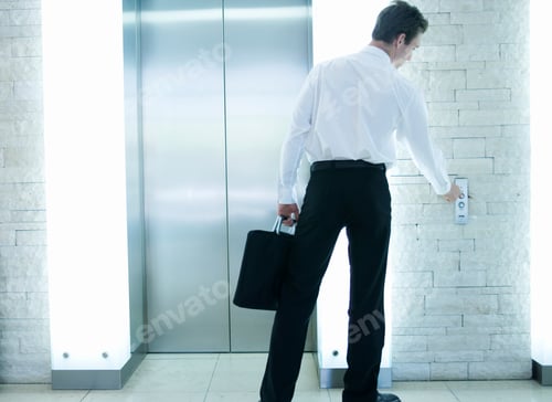 Preview: A Businessman Calling A Lift
