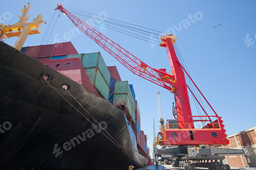 Preview: Low Angle Shot Of A Huge Crane Unloading Containers From The Ship