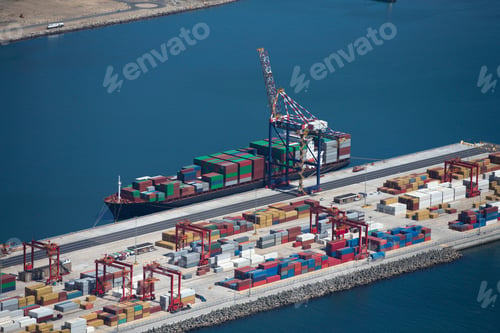Preview: Wide Shot Of The Aerial View Of Container Ships Anchored At A Commercial Dock.