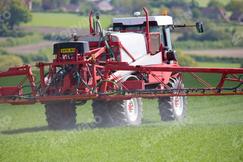 Preview: Tractor Spraying Pesticides In A Green Rural Crop Field