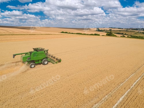 Preview: Harvest Aerial Of Combine Harvester Cutting Summer Oats Field Crop Under Blue Sky On Farm