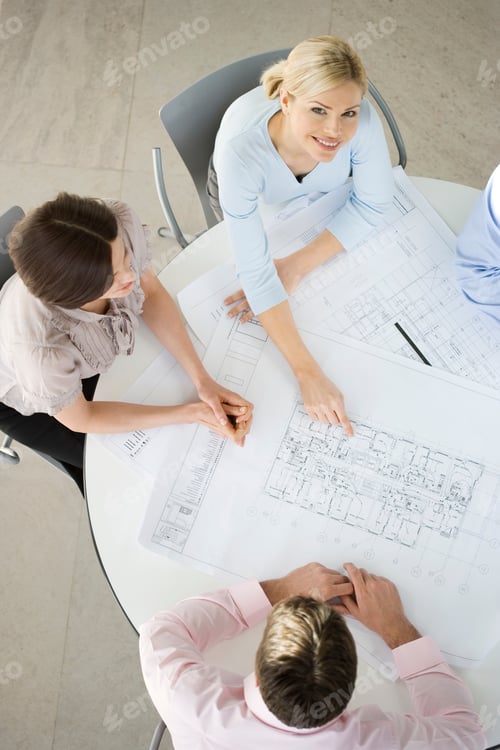 Preview: Four Colleagues Having A Meeting, Discussing Architects Plans