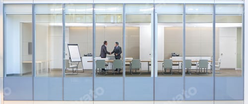 Preview: Wide Shot Through An Office Window With Business Men Shaking Hands In The Meeting Room.