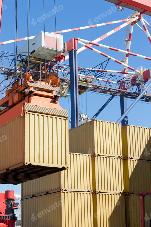 Preview: Cargo Being Lifted From The Stack Using A Gantry Crane At A Dockyard