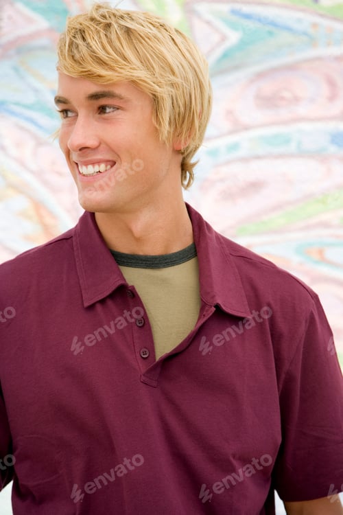 Preview: Portrait Of A Young Man In Front Of A Graffiti Covered Wall