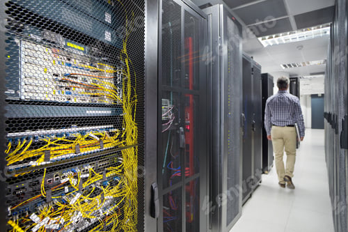 Preview: Technician With A Laptop Walking Out Of The Secured Data Center