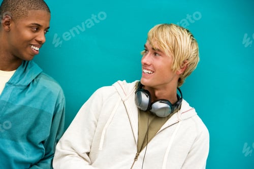 Preview: Two Young Men Leaning Against A Green Painted Wall