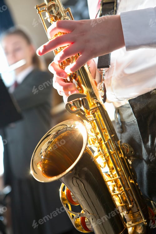 Preview: Close-Up Shot Of A High School Student Playing Saxophone During A Music Class.