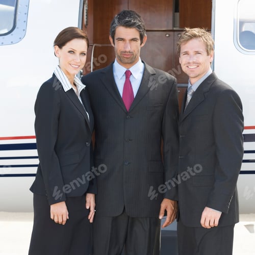 Preview: Three Business Colleagues Standing By A Plane