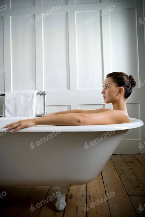 Preview: A Young Woman Laying In A Bath