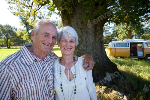 Preview: Senior Couple On Vacation In Camper Van In Countryside At Camera