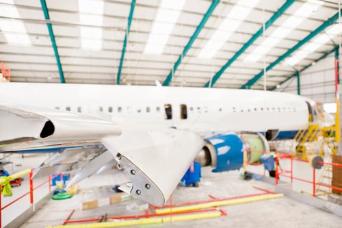 Preview: Close-Up Shot Of The Wing Of A Passenger Jet At A Hangar.