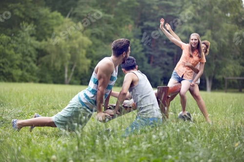 Preview: Couples Playing On Seesaw In Park Together