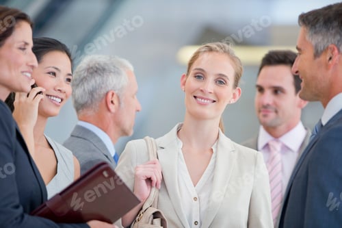 Preview: Portrait Of A Smiling Businesswoman Standing Among Co-Workers