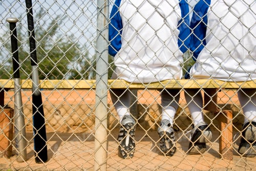Preview: Rear View Youth Baseball Team Sitting On Bench
