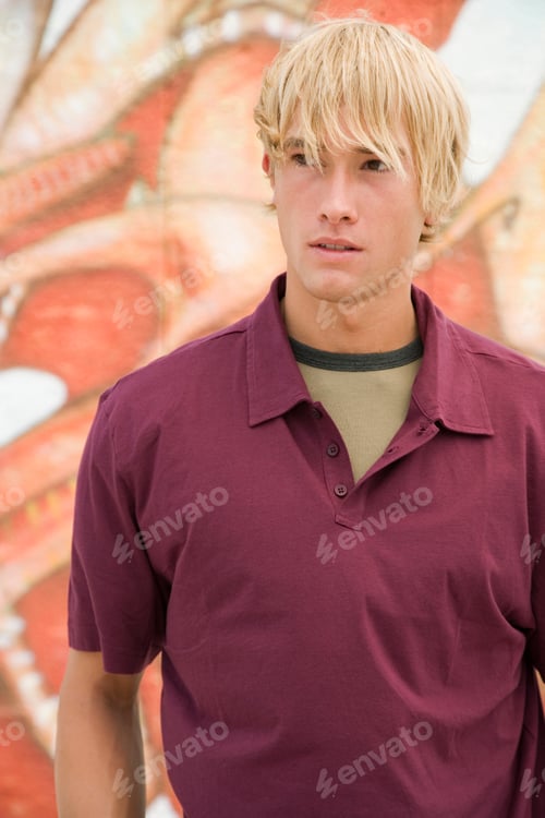 Preview: Portrait Of A Young Man In Front Of A Graffiti Covered Wall