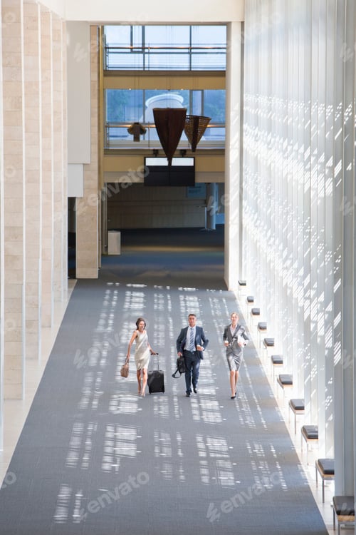 Preview: Business Employees Running In The Lobby Of A Modern Office
