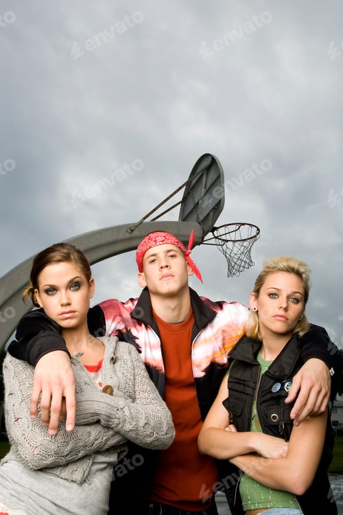 Preview: Three Teenage Friends Hanging Out On A Basketball Court