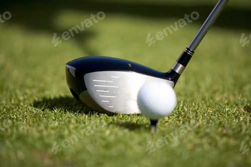 Preview: Close-Up Of A Golf Club And Ball On A Tee