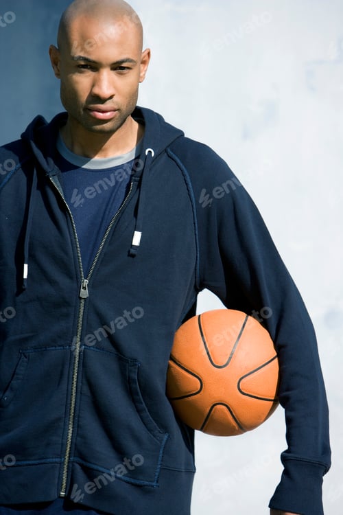Preview: Portrait Of Young African American Man Holding A Basketball