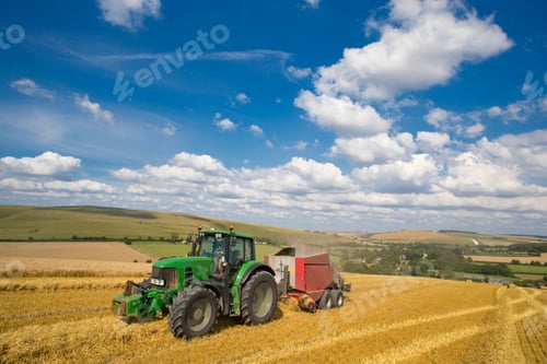 Preview: Tractor Reaping Straw Using A Bailing Machine In A Rural Field.