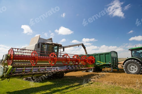 Preview: Combine Harvester Filling Trailer With Wheat