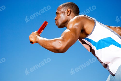 Preview: Relay Runner With Baton In His Hand