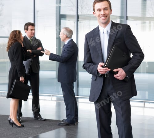 Preview: A Group Of Business Executives In Office Building