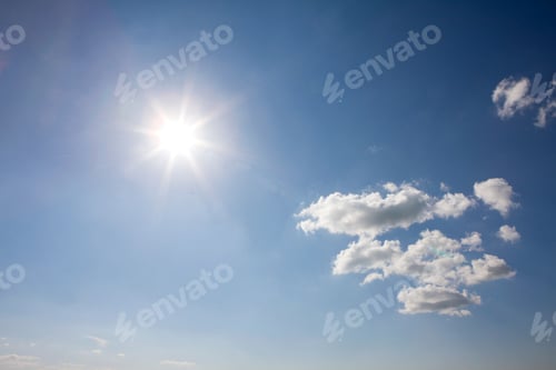 Preview: Bright Sun and Clouds in a Blue Sky