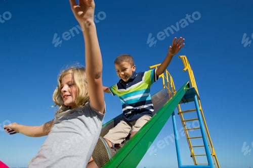 Preview: Smiling Children Sliding Down From A Slide