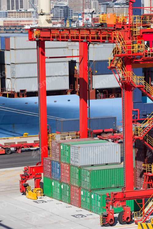 Preview: Vertical Shot Of Crane With Cargo Container At A Commercial Dock.
