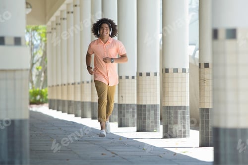 Preview: A Smiling Young Man Running Across The Corridor