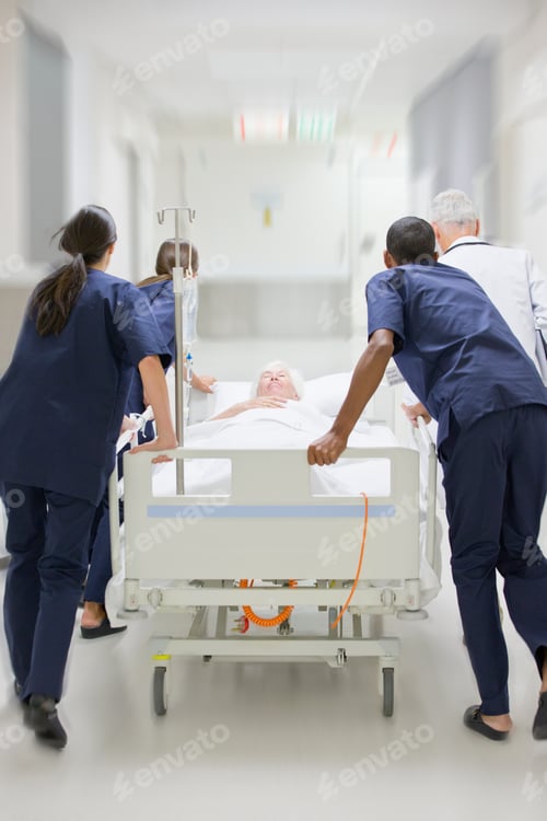 Preview: Vertical Shot Of The Emergency Medical Team Wheeling Patient Along Hospital Corridor