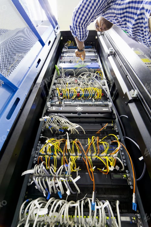 Preview: Low Angle Shot Of A Technician Checking Server In The Data Center