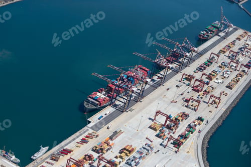 Preview: Wide Shot Of The Aerial View Of Container Ships Moored At A Commercial Dock.