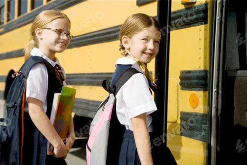 Preview: Two Schoolgirls Getting On A School Bus