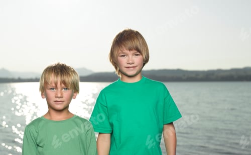 Preview: Two Young Boys Standing Beside A Lake
