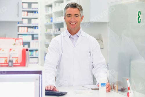 Preview: Pharmacist Smiling At Pharmacy Counter