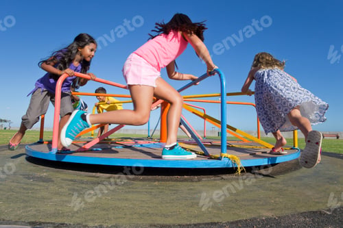 Preview: Children Having Fun Riding A Carousel In A Park