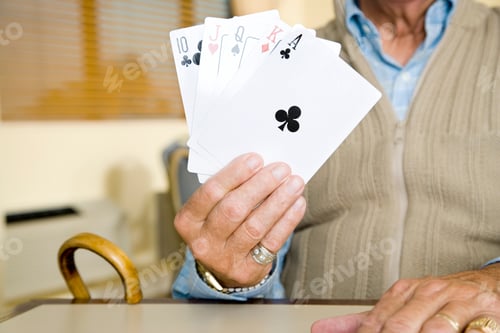 Preview: An Elderly Man Playing Cards