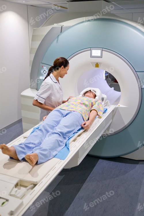 Preview: Vertical Portrait Of A Nurse Preparing A Patient For Mri Scan In The Hospital