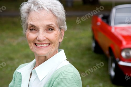 Preview: A Senior Woman Standing By A Sports Car