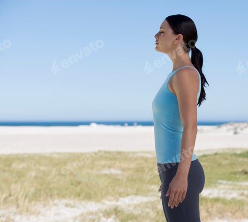Preview: Young Woman Standing On A Beach