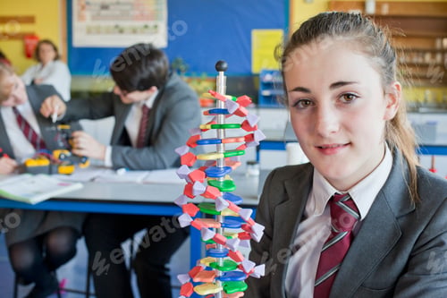 Preview: Portrait Shot Of A High School Student With A Helix Dna Model In A Science Class.