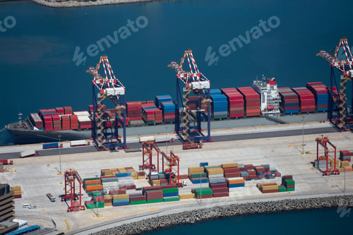 Preview: High-Angle Shot Of The Side View Of A Container Ship Anchored At A Commercial Harbor.
