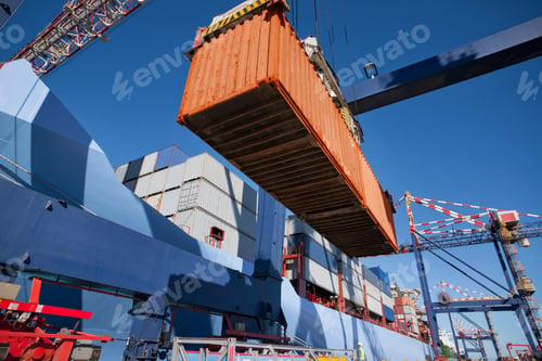 Preview: Low Angle Shot Of A Cargo Container Being Placed On The Ground Using A Gantry Crane