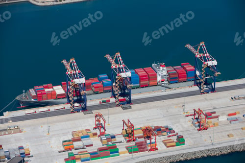Preview: Aerial View Of Container Ship Full Of Cargo Moored At A Commercial Dock Waiting To Be Unloaded