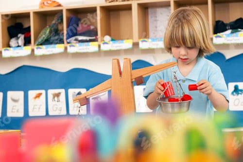 Preview: A Boy Doing An Activity Using A Weighing Balance At His School.